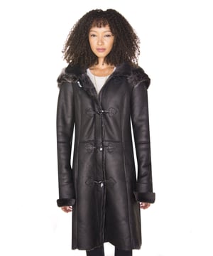 Sheepskin jackets gained huge popularity amongst celebrities in the 1940s and 1950s and have been regarded as a symbol of status for women during various time periods. Our jackets are crafted from the highest quality double faced sheepskin and feature a thick woollen lining that is renowned for its natural ability to retain body heat, making it the ideal material choice during winter. This jacket is all about sophistication. Featured in our premium black brissa colourway, this piece has a gorgeous, classy look to it which is accented by the appearance of sheepskin at the cuffs and hood. The jacket front is fastened by classic leather trimmed toggles and a concealed zip that runs below the collar, which can be stood up and fastened with a button for even more protection against the cold. • Crafted from high-quality double-faced sheepskin • Thick sheepskin lining is renowned for providing warmth and comfort • Features a drawstring adjustable detachable hood • Furnished with a front zip and toggled closure