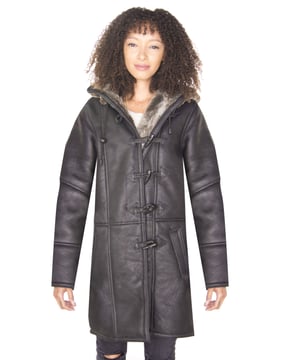 This duffle coat maintains all the features that have made it a cherished piece of fashion and introduces a higher quality to the style using our double-faced Merino sheepskin. The interior features a thick woollen lining that is unparalleled as a provider of warmth and comfort and is seen at the cuffs and the hood to provide a bold accenting feature against the black jacket coat. The coat has a traditional toggled fastening and a contemporary hood which is both wind proof and rain resistant and can also be adjusted via drawstrings for extra comfort. • Crafted from high-quality double-faced sheepskin • Thick sheepskin lining is renowned for providing warmth and comfort • Features a toggled closure with a drawstring adjustable hood • Two hand warmer pockets at the waist