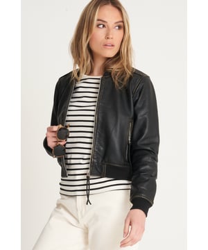 Introducing the Barneys Originals Washed Cropped Bomber Jacket – a fusion of contemporary style and timeless appeal. Crafted with textured leather, this jacket not only adds an edgy dimension but also offers a unique tactile experience. The cropped design adds a modern twist to the classic bomber silhouette, making it a versatile choice for any occasion. The washed finish lends a vintage charm, ensuring that each piece is distinctively yours. Elevate your fashion game with this Barneys Originals jacket – where texture meets trendsetting in a cropped bomber masterpiece.