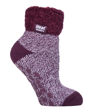 Lounge around the home in these cosy socks. Whether you're looking to stay warm or comfortable indoors, these lounge socks feature a cute and stylish design so you can pair them with any casual outfit! Every Heat Holders® sock, including these lounge socks, are created by UK PATENTED knitting technology. This unique manufacturing process together with Heat Holders® innovative Japanese designed thermal yarn ensures maximum warmth is held close to the skin, keeping your feet warmer for longer. With a strong TOG rating of 2.34, these socks are designed to keep your feet warm as well as retain heat close to the skin. They also prevent your feet from feeling clammy with their soft brushed inner thermal lining. With long pile cushioning, these thermal socks will help keep feet fully comfortable and supported. Heat Holders are made from a specially developed heavy bulk yarn which has extreme thermal-like qualities. These socks would make the perfect gift for any woman who suffers cold feet! Choose from our different colours and styles to suit your woman's fashionable needs! Why not treat yourself to these lovely pair of cosy socks to wear in bed? Featuring a turn over cuff, you can pull up or roll down these socks for a much more comfortable fit! These socks also have a low cut ankle length so you can subtly show off your socks! Stop sliding or slipping on wooden or tiled floors with these non-slip gripped socks. They feature a rubber-like non-slip grip so you can walk around the home comfortably. These socks are available in womens sizes 4-8 UK