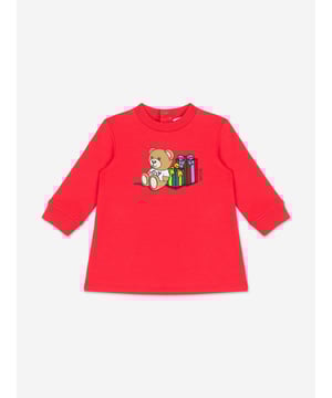 Italian fashion House Moschino depict energy and precision into their fun-filled abstracts. This baby girls poppy red sweater dress is reflective of the label's passion for the teddy bear motif and its reconceptualised forms. It showcases an adorable beady-eyed teddy bear with gifts via delicate embroidery in high quality cotton.‚ Crew Neck‚ Long Sleeves‚ Back Button Closure‚ 95% Cotton, 5% Elastane