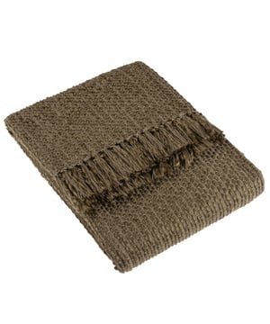 In muted earthy tones and solidly crafted from super soft, woven blends of yarn, the Morni throw instantly creates a warm, understated style for your soft furnishings. The design is complimented by tassel fringing on two sides and is ideal if you love to build up textures within a modern, neutral interior.