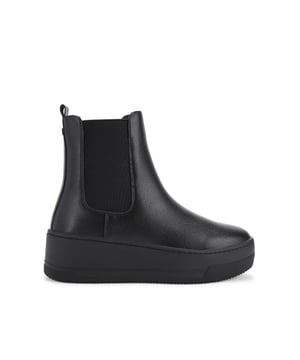 The KG Kurt Geiger Tanvi is an ankle boot with textured black upper. There are two elasticated ankle panels for slip-on comfort and small tab at the back of the ankles The sole is extra chunky.