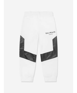 French luxury label Balmain breach the constraints of tradition by exploring new forms of innovation. These unisex black and white joggers embody original high quality and craftsmanship. Envisioned in a contrast PVC material showcasing 'Balmain Paris' black gel detail, pockets and an elasticated waistband.  100% Cotton