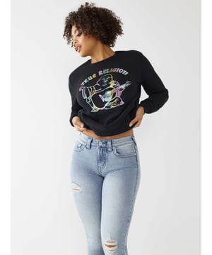 Keep it cute and comfy in the Buddha Crewneck Sweatshirt. Designed from a cozy cotton blend, this women's sweatshirt features a crewneck and multicolor shimmer Buddha graphic across the front.