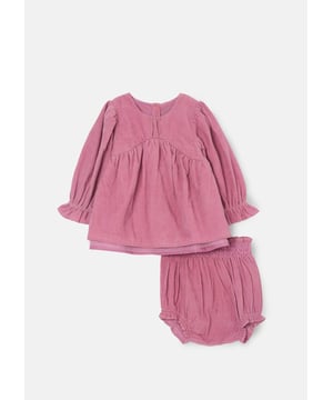 Pretty in  ! We're swooning over this sumptuously soft cord dress for tiny tots. Featuring a shirred waist and bow detail. it comes complete with matching bloomers for maximum comfort and practicality. Just perfect.