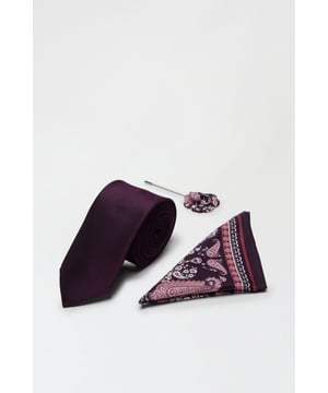 Three-piece set including tie, pocket square, and lapel pin
        Rich, deep hues create a striking contrast
        Elegant paisley pattern adorns the pocket square
        Sleek, slim-profile tie for a modern silhouette
        Coordinated lapel pin adds a sophisticated touch
    
    Elevate your formal attire with this exquisite three-piece tie set from Burton. Perfect for the discerning gentleman who appreciates classic style with a contemporary twist, this ensemble is ideal for a range of smart occasions. Whether you're attending a wedding, heading to an important business meeting, or enjoying a night at the theatre, this set will ensure you look impeccably put-together. The deep, rich tones create a bold statement, while the intricate paisley pattern on the pocket square adds visual interest and depth to your outfit. Pair with a crisp white shirt and a well-tailored suit for a look that commands attention and respect. This versatile set allows you to effortlessly transition from day to evening events, making it an essential addition to any sophisticated wardrobe.