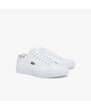 Drawing inspiration from the Lacoste archives  the Gripshot has a distinctively vintage aesthetic. This low-top pair features leather uppers and chunky herringbone-textured outsoles  while branding throughout offers a signature finish. • Vintage-inspired vulcanized shoe • Leather uppers • Textured detailing to heel • Embroidered and debossed branding on tongue and heel • Embroidery Crocodile on side • Chunky herringbone-textured outsoles