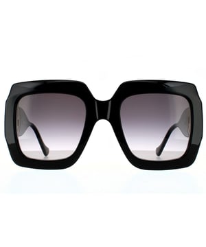 Gafas de sol Gucci Rectángulo para mujer en negro y gris degradado. Las gafas Gucci son un diseño cuadrado oversized que destaca por su robusto armazón de acetato y su gran logo GG entrelazado de metal incorporado en las amplias patillas.