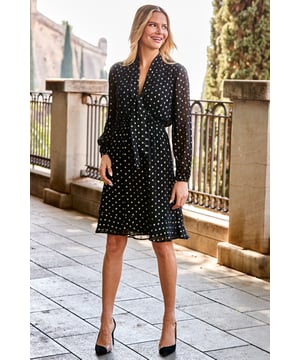 REASONS TO BUY:

Your AM to PM party piece
Scattered with shimmering gold spots
Comfy elasticated waist - perfect for eating, drinking and dancing
Sexy sheer blouson sleeves
Topped with a chic neck tie
Style with strappies or knee-highs and a faux fur jacket
