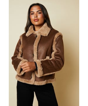 Cropped aviator-style jacket with contrasting trim
        Plush faux fur lining for warmth and comfort
        Oversized collar for a bold, statement look
        Long sleeves with cuffed detailing
        Versatile design suitable for various casual occasions
    
    Embrace the timeless appeal of aviator style with this chic cropped jacket from Dorothy Perkins. The contrasting trim and plush faux fur lining create a luxurious look and feel, perfect for those chilly autumn days. Style it with wide-leg trousers and ankle boots for a sophisticated brunch ensemble, or pair it with your favourite jeans and trainers for a relaxed weekend look. The versatile design makes it ideal for family gatherings, casual outings with friends, or even a laid-back date night. The oversized collar adds a touch of drama, while the cropped length allows for easy layering over jumpers or long-sleeved tops. This jacket is a must-have addition to your wardrobe, offering both style and practicality for the fashion-conscious woman who values comfort without compromising on trend.