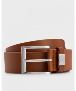 An elegant 4cm belt by BOSS. Securing with a silver-tone pin buckle, this essential accessory is crafted in Italian leather with a vegetable-tanned finish for a characterful patina. The leather keeper features a metal logo trim for a distinctive touch. For the best fit, we advise ordering a belt one size larger than your waist size.
Engraved logo on closure
100% Cow skin
50475116