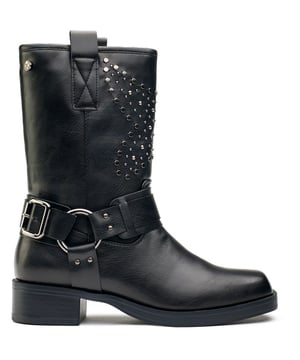 Womens black Xti studded biker boots, manufactured with synthetic and a rubber sole. Featuring: studded detail, decorative ankle strap and xti branding.
