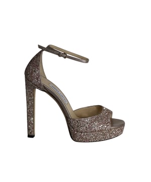 VINTAGE, RRP AS NEW
Perfect for a night of cocktails and dancing, this pair of Jimmy Choo Platform Sandals are a must-have! With their eye-catching pink glitter and high heel, these shoes look great with any outfit.
*with box and dust bag

Jimmy Choo Platform Sandals in Pink Glitter
Material: Glitter
Size: IT39
Condition: Very good
Sign of wear: Moderate wear on soles and insoles
SKU: 290148