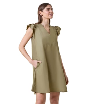 Plain Cotton Frill Sleeve Pocket Dress from Roman. Get set for those sunny days ahead with this cooling cotton dress by Roman. Designed with a flattering v-neckline, this dress features cute frill sleeve details and shirring at the shoulders. Cut from a cotton woven fabric for a light and airy fit, this a-line shape is perfect for casual days. Easy to pull on and go, this dress is a plain canvas which is ready for accessorising, simply pair with sandals and a denim jacket for effortless Summer styling!