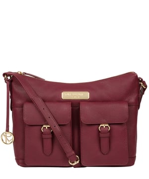 Crafted from leather that has soft pebble grain finish, the 'Jenna' shoulder bag from Pure Luxuries London comes with eye-catching gold-coloured fittings. The zip-over top secures a 100% cotton lined compartment, complemented by two internal pockets along with three external pockets that provide on-the-go storage; two of which are fastened with mock buckle press-studs. Comes with an adjustable matching leather strap and is adorned with the gold-coloured Pure Luxuries London charm and logo.
