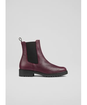 Make a bold statement with these Cadea ankle boots, perfect for casual wear. Crafted in Spain from luxurious textured leather, the tread sole boot features a round toe and a flat tread sole for ultimate comfort. These boots pair effortlessly with skinny jeans or a flowing midi dress for a stylish, versatile look.