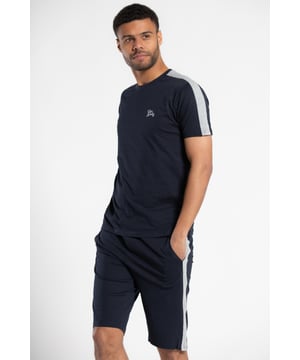 Stay comfortable with this cotton jogger short and t-shirt lounge set. The shorts feature a combed cotton interior and drawstring waist for a soft and adjustable fit, while the t-shirt is made from 100% cotton for ultimate breathability.  Perfect for lounging, this set is a comfortable addition to your wardrobe. Both pieces are machine washable, making them easy to care for.