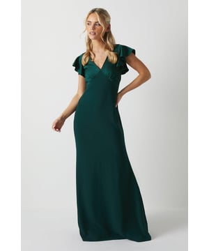 V-neckline with short angel sleeves                      Smooth, satin fabrication                      A-line silhouette with bow back detail                      Concealed zip closure                      Tailored fit through bodice and waist                                 This refined satin bridesmaid's dress from Coast exudes elegance. Designed in an A-line silhouette that flatters the figure, it features a classic V-neckline and short angel sleeves for a romantic look. The smooth satin fabrication drapes beautifully, while the bow back detail adds a touch of charm. Discreetly fastened with a concealed zipper, this dress offers a tailored fit through the bodice and waist for a polished appearance.                Pair this dress with delicate high heels and minimal jewellery for formal weddings or summer black tie events. The versatile solid hue complements various colour palettes, from soft pastels to rich jewel tones. For garden ceremonies and rehearsal dinners, add a cropped jacket or pashmina wrap to complete the look. With its timeless silhouette and delicate details, this satin bridesmaid dress transitions effortlessly from day to evening affairs.