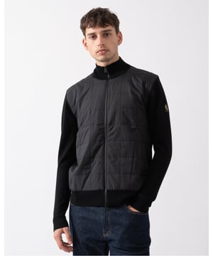 The Kelbrook zip cardigan. Inspired by military uniforms and made for updating your daily wardrobe, this boxy zip-through knit combines structured panelling with soft merino wool for an elevated finish.

Extra fine merino
Channel quilted shoulder reinforcement detailing
Ribbed cuffs and hem
Quilted mixed media body
Belstaff phoenix patch on left sleeve
Two-way zip centre front closure
Non-mulesed wool

Body: 100% wool, Woven: 100% polyester, Filling: 100% polyester
105303