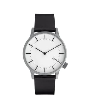 La marca Komono significa "pequeños artilugios" en japonés y eso es exactamente lo que la marca quiere transmitir con sus productos. Con sus relojes, Komono se centra en el minimalismo y en apreciar las pequeñas cosas de la vida. El reloj Komono Winston Regal en color negro es un reloj masculino versátil que atraerá a casi cualquier hombre. Con una resistencia al agua de 3 ATM, este reloj puede soportar la mayoría de las situaciones cotidianas. La correa de cuero negro garantiza comodidad y durabilidad. El movimiento plateado es de acero inoxidable y tiene un diseño atemporal que es a la vez resistente y elegante. Este reloj no sólo es un complemento con estilo para cualquier atuendo, sino que también es funcional gracias a su precisa indicación de la hora. Tanto si acude a una ocasión elegante como si sólo desea realzar su aspecto diario, este reloj de pulsera para hombre es perfecto. Comprará el reloj Komono Winston Regal con descuento en las rebajas. Reloj Komono para hombre negro/blanco en oferta El reloj Komono Winston Regal negro es una elección elegante para aquellos que buscan un accesorio atemporal. Este reloj es resistente a salpicaduras hasta 3 ATM. No es apto para la ducha ni para nadar. La correa del reloj negro está hecha de cuero de alta calidad y tiene una anchura de 20 mm, por lo que se ajusta cómodamente a la muñeca. Con una longitud de 244 mm, este reloj se adapta a casi cualquier tamaño de muñeca. La caja de acero inoxidable con cristal mineral protege el movimiento y confiere al reloj un aspecto duradero. Con un diámetro de 41 mm y un grosor de 9 mm, este reloj es a la vez elegante y funcional. El reloj Komono Winston Regal es el compañero perfecto para cualquier ocasión. Compre ahora el reloj Komono para hombre en oferta. Ver todos los modelos de relojes.  Marca: KomonoNombre del modelo: Winston Regal W2268 (41mm)Categoría: reloj de pulseraMateriales: acero inoxidable, cueroColor: negro, blanco, plataResistente al agua: 3 atm (a prueba de lluvia y salpicaduras)