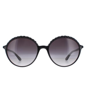 Elle Round Womens Black Grey Gradient 14919  Sunglasses are a fashionable round design that effortlessly combines elegance with a touch of edginess. The frame is expertly crafted from high-quality acetate, ensuring durability and a comfortable fit that lasts all day. The Elle logo features on the slender temples for brand recognition.