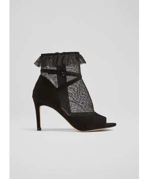 Sheer and sexy, our Juliette ankle boots are a statement style that's ready to party. Crafted in Spain from black suede and a black dot mesh, they are an elegant peeptoe style with crossover ankle strap detail, a ruffle trim, an inside zip and an 85mm stiletto heel. Wear them with party dresses for evenings and occasions during winter's party season.