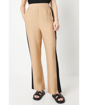 Straight-leg woven trousers with contrasting side stripes
Elasticated waistband for a comfortable fit
Sleek woven fabric with a smooth drape
Versatile straight-leg silhouette
Easy machine wash care

Embrace effortless style with these woven trousers from Debenhams. The contrasting side stripes add a sporty touch, while the straight-leg silhouette offers a flattering fit. Pair them with a relaxed tee and trainers for a casual daytime look, or dress them up with a blouse and heels for a chic evening ensemble. Perfect for family gatherings, weekend brunches, or running errands in style.