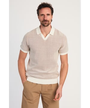 This textured honeycomb knit polo shirt from Kensington Eastside blends classic sophistication with modern design. Crafted from a premium honeycomb knit fabric with a stylish V-neckline, it offers a refined yet contemporary look. Lightweight and breathable, it’s a versatile choice for smart-casual occasions, ensuring style and comfort effortlessly.
