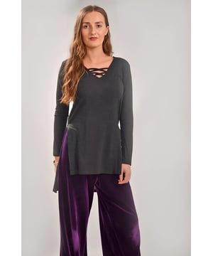 This comfortable tunic is certain to be one of those all time favourites that you come back to buy another colour of because it just works for every occasion.  Pretty V-Neck Tunic with Side Splits at Hem

Medium Weight Jersey
61% Polyester, 34% Viscose, 3% Elastane
Sizing is as expected
Length:29" Shoulder to Hem