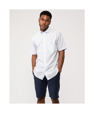 
 Crafted from a crisp cotton poplin with a classic gingham pattern, this short-sleeved shirt from GANT is timeless and versatile. Designed for a regular fit, it features a button-down collar, chest pocket and a box pleat with the signature GANT locker loop invention at the back. It is accented with an '80s archive-inspired GANT shield graphic embroidered at the chest. This shirt pairs easily with jeans and chinos.


Regular fit
Button-down collar
Chest pocket
Short sleeves
Recycled polyester buttons
Box pleat with locker loop at back
GANT graphic embroidered at chest pocket

 100% cotton 

3000121
 