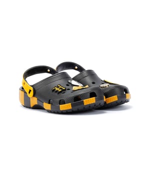 Inspired by Harry Potter’s Hufflepuff House scarf in yellow and black, these Classic Clogs are lightweight, water-friendly, and buoyant. Featuring breathable ventilation ports and pivoting heel straps for a secure fit, they're perfect for fans seeking style and comfort. Customisable exclusive Hufflepuff-inspired Jibbitz™ charms.