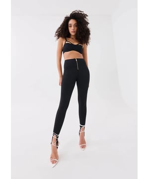 A high-rise stretchy legging combines a fashion-forward look with a high-performance fabrication for the ultimate elevated street-sport offering. Full-length legging with stirrup, cut from super-soft matte scuba-vibe fabrication. Featuring quilted side panels, a classic P.E Nation gold-plated zipper at centre front and a self lined waistband for extra support for your day to night movements.