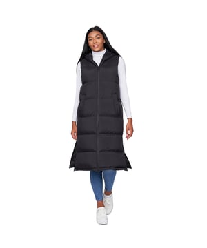 100% Nylon. Design: Logo, Quilted. Neckline: Hooded. Padded. Sleeve-Type: Sleeveless. Hood Features: Grown On Hood, Toggle Adjuster. Length: Longline. Pockets: 2 Side Pockets, Welted. Fastening: Full Zip, Two Way Zip. Hem: Split, Zipped. 10 UK: 34 in. 12 UK: 36 in. 14 UK: 38 in. 16 UK: 40 in.