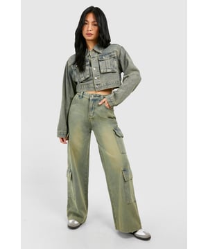 Wide leg cargo jeans with vintage wash effect
        Multiple utility pockets for added functionality
        Cropped jacket with matching wash and pocket details
        High-waisted design for a flattering silhouette
        Relaxed fit through legs for comfort and style
    
    Make a bold statement with these eye-catching cargo jeans, perfect for the fashion-forward trendsetter. The wide-leg silhouette offers a contemporary twist on a classic denim style, whilst the vintage wash adds character and depth. Pair with the coordinating cropped jacket for a head-turning denim-on-denim ensemble that's sure to turn heads. For a casual daytime look, team with a simple white crop top and trainers. Dress it up for evening drinks by swapping trainers for heeled boots and adding statement jewellery. These versatile jeans are ideal for various casual occasions, from weekend brunches to music festivals. The multiple pockets not only add to the utilitarian aesthetic but also provide practical storage for your essentials. Embrace the Y2K revival trend and make these cargo jeans your go-to piece for effortless, street-style inspired outfits.