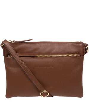 The 'Hannah' cross body bag from the Pure Luxuries London Marylebone Collection is handcrafted from high-quality, genuine Nappa leather with a natural super-soft touch. A zip over-top secures the main compartment, lined with 100% cotton. Features two internal slip-pocket that help maintain an organised bag. A zipped pocket on the front of the bag provides on-the-go storage. Comes with a matching and adjustable slim leather strap with a maximum drop length of 64cm. Furnished with gold-coloured metal fittings and zips. The Pure Luxuries logo is embossed for an effortless and sophisticated finishing touch.