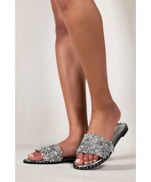 These wide fit flats designed with extra room across the band of the shoe glide smoothly and comfortably over your feet with a padded sole and a sparkly embellished strap across the front. The soft sole is padded to keep you comfortable. The embellished strap adds glamour to this already beautiful pair of sandals. They are truly one of a kind!