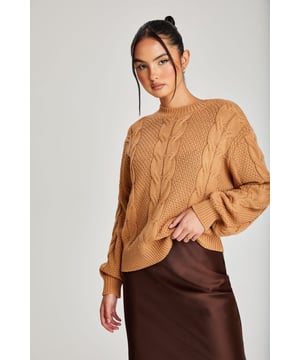 Model is 5'6 and wears a size 8. Regular fit. Cable Detail.