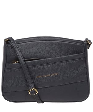 The 'Helena' cross body bag from the Pure Luxuries Marylebone collection is handcrafted from high-quality, genuine Nappa leather with a natural super-soft touch. The zip-over top opens to reveal a 100% cotton-lined interior. The spacious compartment features two slip pockets to help maintain an organised bag. A zipped pocket on the front of the bag provides on-the-go storage. Features gold-coloured metal fittings and zips alongside the adjustable slim leather strap, with a maximum drop length of 65cm. The Pure Luxuries logo is embossed in gold foil for a beautifully simple finishing touch.