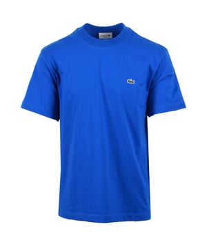 Lacoste Tee in Gipsy Blue
Experience the unmatched quality and timeless style of the Lacoste Tee in Gipsy Blue. Crafted by sportswear experts since 1933, this essential piece is a testament to Lacoste's commitment to using the finest materials. Made from premium Peruvian Pima cotton, this tee boasts a particularly fine, light, and hard-wearing fabric with a subtle sheen. The 130 GSM weight provides a comfortable feel, while the regular, straight cut offers a classic silhouette. Finished with the iconic embroidered crocodile on the chest.
 
Features

Premium Pima Cotton: Experience the luxurious feel of 100% Peruvian Pima cotton, known for its superior softness and durability.
Lightweight Fabric: The 130 GSM fabric provides breathability and comfort for all-day wear.
Classic Fit: A regular, straight cut offers a timeless silhouette that looks great on everyone.  Please note: If you are between sizes, we recommend ordering one size up for a more comfortable fit.   
Iconic Branding: The embroidered crocodile on the chest adds a touch of signature Lacoste style.   
Versatile Style
Style code: TH7318