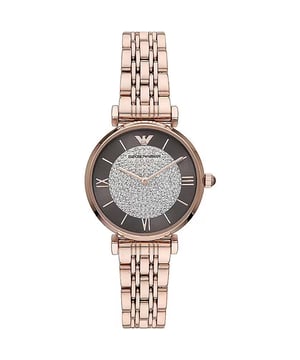 Brand: Emporio Armani
  Series: Gianni T-Bar
  Gender: Ladies
  Model: AR11402
  Movement: Quartz
  Case Size: 32mm
  Case Thickness: 8mm
  Case Material: Stainless Steel
  Case Shape: Round
  Case Back: Solid
  Band Material: Stainless Steel
  Band Type: Bracelet
  Band Color: Rose Gold-tone
  Band Width: 14mm
  Clasp: Butterfly
  Dial Color: Brown (Crystal Pave)
  Type: Analog
  Crystal: Scratch Resistant Mineral
  Hands: Rose Gold-tone
  Dial Markers: Index
  Second Markers: Roman Numerals appear at the 3 6 and 9 oclock positions
  Bezel: Fixed
  Bezel Material: Stainless Steel
  Crown: Pull/Push
  Water Resistance: 30 meters / 100 feet
  Functions: Hour Minute
  Watch Features: Stainless Steel Gold Analog
  Watch Style: Dress
  Code: AR11402
Material: Steel