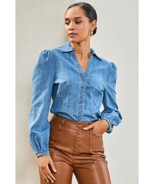 REASONS TO BUY:

Denim, but make it chic
Crafted from ultra-soft chambray
Figure-flattering fitted shape
Blouson sleeves for added chic
Tuck it into leather for a luxe look
Do double denim with our cut-to-flatter jeans