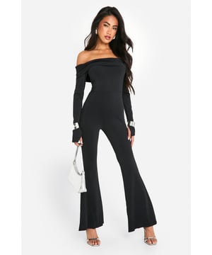 On the hunt for the perfect new-season piece? This bardot jumpsuit is just for you. Sitting off the shoulder for a flattering fit, an off the shoulder jumpsuit is the perfect addition to your summer collection. Curve accentuating, shoulder enhancing, and super easy on the eye, this style seriously brings the heat. From classic black bardot jumpsuits with ruffle detailing to white bardot jumpsuits perfect for long summer days, we've got you covered. Just add strappy sandals and you're ready to go. Style: UnitardFabric: SlinkyLength: RegularNeckline: BardotSleeve Length: Long Sleeve