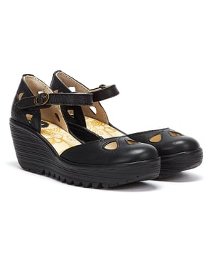 The Yuna from Fly London is a platform sandal with elevated heel. Features include premium materials, drop-shaped cut outs, and a round buckle fastening. Complete with signature Fly London branding.