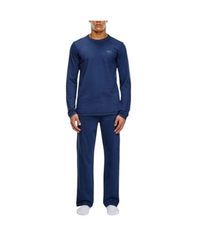 Diesel Men's Pyjama Set
Style Name: UMSET ARAMIS
Style Code: 0THAU
100% Cotton 
Made In India
Regular Fit
Brand Logo
Solid Logo
Crew Neck 
Long Sleeve T-Shirt
Side Slit Hem Line
Adjustable Drawstring With Pyjama
Full Set (Top And Botton)
Size: S-XL
Colour: Navy Blue
Machine Wash (Please See The Instruction Before Wash)