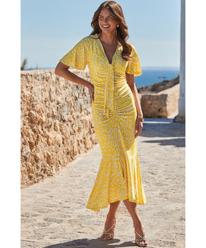 A ray of sunshine for your wardrobe
Soft and drapey fabric hugs your curves in all the right places
That ruched front is so flattering
Finished with stunning angel sleeves and a swishy tiered hem
Chic tie neck detail
Think courts for the office, strappies for special occasions