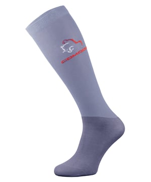 Comodo Microfibre Horse Riding Socks  Comodo have been providing high-quality socks for men and women since 1996. They sell a range of socks for hiking, cycling, hunting, skiing, and now, horse riding! Whichever type of socks you wear, your feet are bound to feel comfortable and warm, no matter the weather or environment!  It's important to wear soft and comfortable socks when horse riding. That's why Comodo have crafted microfibre horse riding socks foe men and women.  These socks are lightweight and functional as they fit effortlessly under riding boots for a cool, comfortable ride.  They have been constructed in fine microfibre to provide maximum protection against abrasion, and the breathable knit keeps legs cool in the summer and warm in the winter.  The soft touch cotton material also helps to wick away moisture and sweat especially, if you've been horse riding for longer hours in the summer.  With their support and reinforcements in all the right places, Comodo riding socks are sure to look great and maintain their condition wear after wear.  Choose from these colourful block panels for your favourite pair of horse riding socks. These socks are made from 45% Polyamide Microfibre, 25% Cotton, 25% Polyamide, 5% Elastane. They are available in sizes 3-5.5 UK, 6-8 UK, 35-38 EU, 39-42 EU. These socks are hand washable at 30 degrees.  Extra Product Details  - Microfibre Horse Riding Socks  - Lightweight Feel  - Microfibre Leg  - Knee-High Length  -Cotton Foot  - Reinforce Sole  - Men and Womens  - Hand Washable at 30  - 45% Polyamide Microfibre, 25% Cotton, 25% Polyamide, 5% Elastane