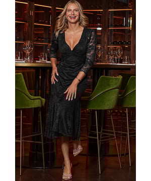 All of the impact, none of the effort Cut from luxurious lace with the perfect amount of stretch That twist neckline is so flattering Nipped-in waist falls to a dreamy tiered hem Framed by stunning sheer puff sleevesAdd some sparkle with jewelled accessories