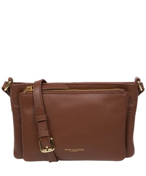 Handcrafted from super soft natural Nappa leather, the 'Jess' cross body bag from Pure Luxuries London's Marylebone Collection is a must-have thanks to the spacious design. The dual main compartments are secured with a zip-over top which opens to reveal the luxurious 10% cotton lining. Additional storage space is provided by two slip pockets in the larger compartment - ideal for maintaining an organised bag. The accessory is adorned with gold-coloured metal fittings and zips which complement the slim and adjustable leather strap with a maximum drop length of 65cm. The Pure Luxuries logo is embossed in gold foil for a beautifully simple finishing touch.