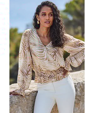 Animal print is always a good idea
Crafted from gorgeous floaty fabric
Made-to-flatter wrap front and shirred waist
Framed by dreamy blouson sleeves
Pair with cigarette trousers for a chic office look
Add jeans and heels for Saturday night drinks